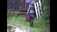 Play A mature woman having sex in the rain